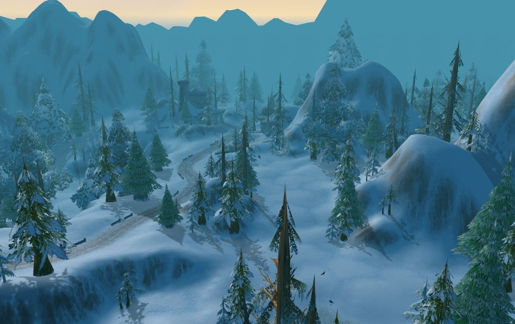 A snowy valley of firs and a winding road in Dun Morogh
