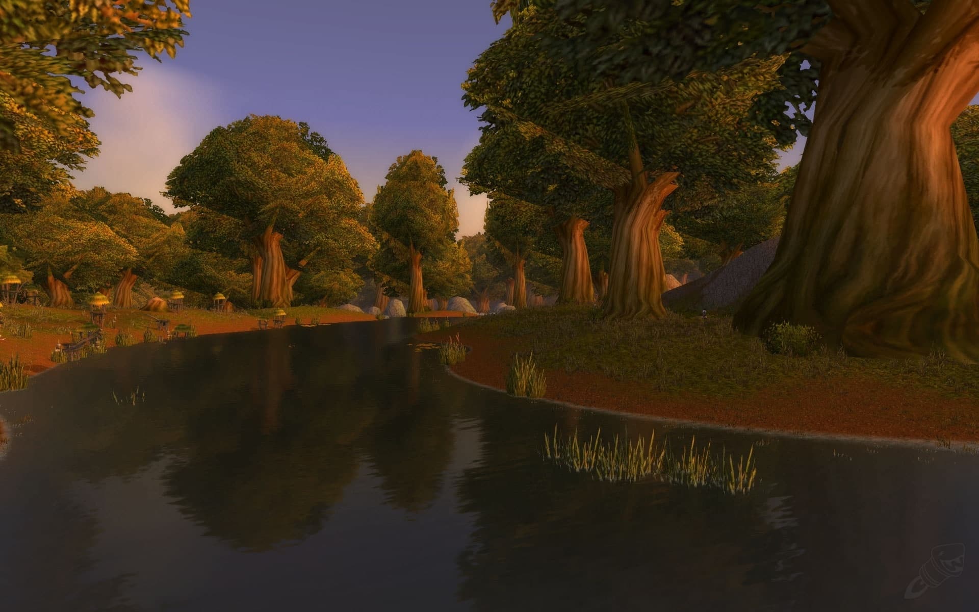 A still lake under oak trees at dusk in Elwynn Forest